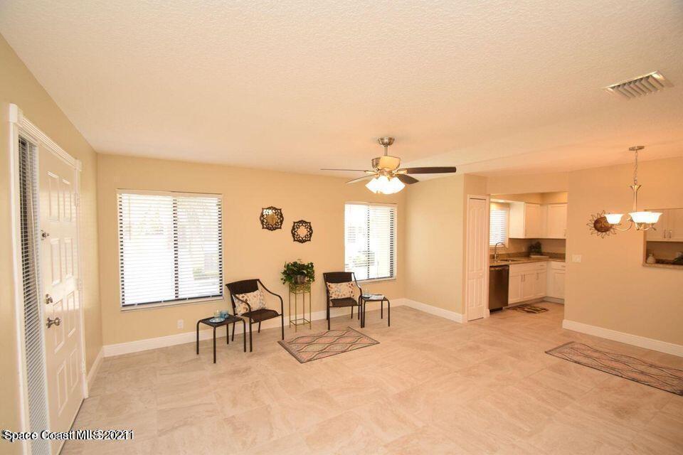 670 Cedar Side Circle Northeast Palm Bay, FL 32905 - Photo 10 of 22 a view of a livingroom with furniture and a window
