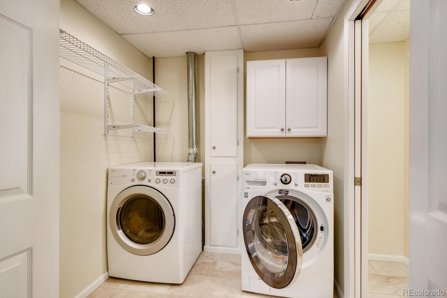 9840 South Castle Ridge Circle Highlands Ranch, CO 80129 - Photo 24 of 28 a utility room with dryer and washer