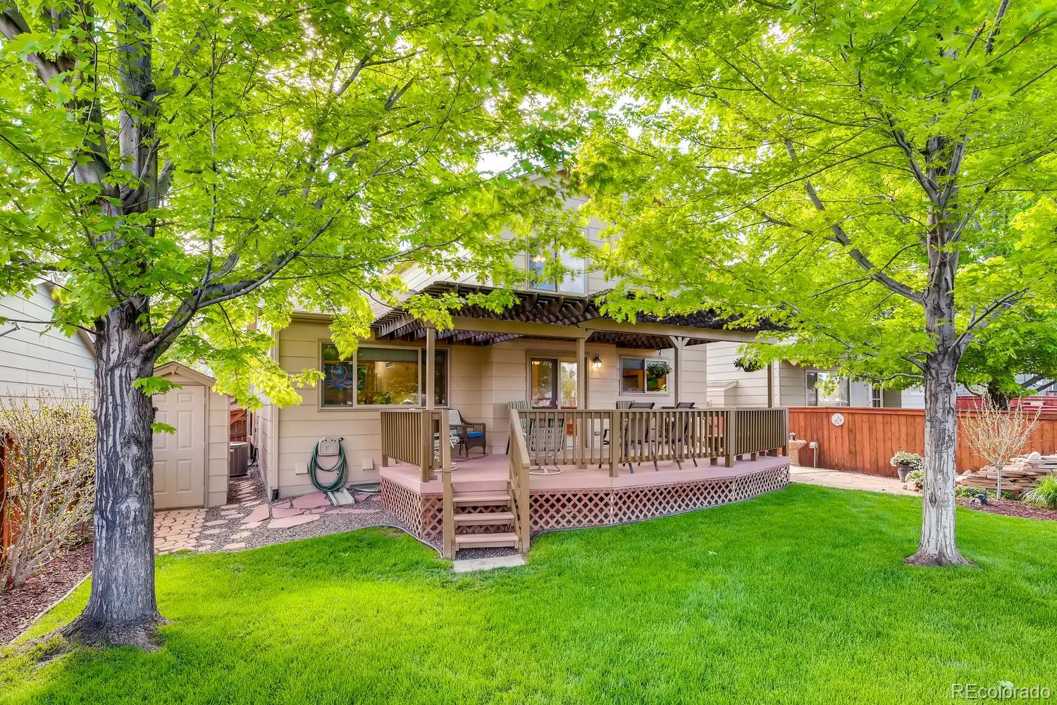 9840 South Castle Ridge Circle Highlands Ranch, CO 80129 - Photo 28 of 28 a view of a house with a yard porch and sitting area