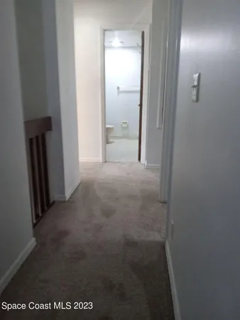 a bathroom with a glass door shower