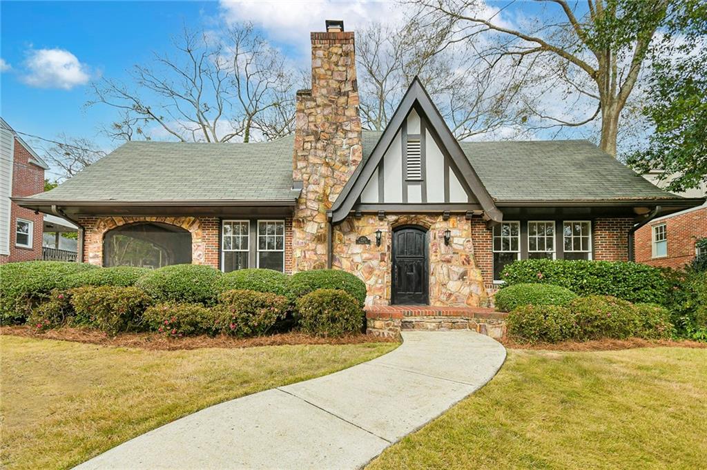 230 Bolling Road Northeast Atlanta, GA 30305 - Photo 1 of 1 a front view of a house with yard and green space