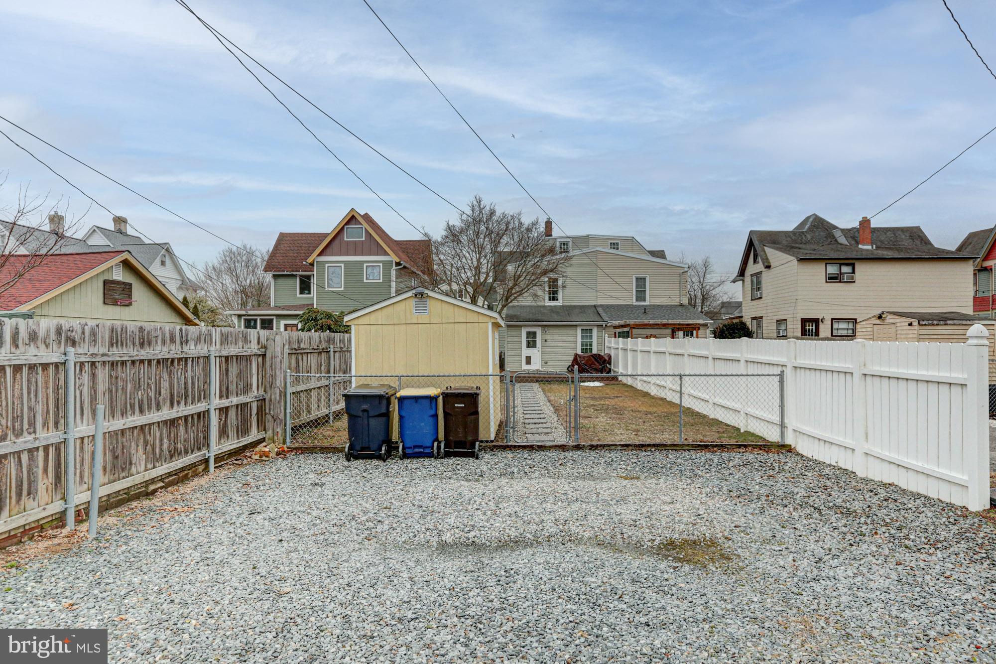 421 Main Street Clayton, DE 19938 - Photo 15 of 77 a view of a house with a backyard and balcony