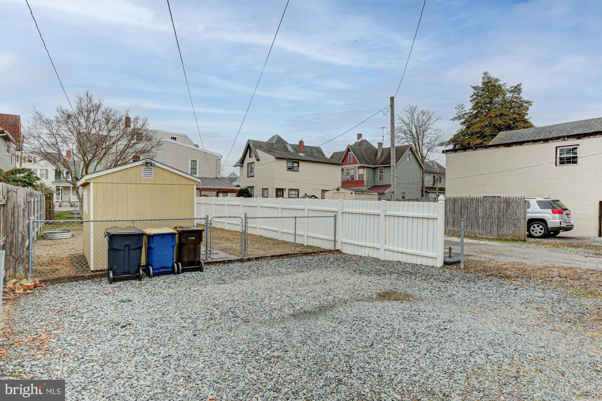 421 Main Street Clayton, DE 19938 - Photo 16 of 77 a view of a house with a backyard