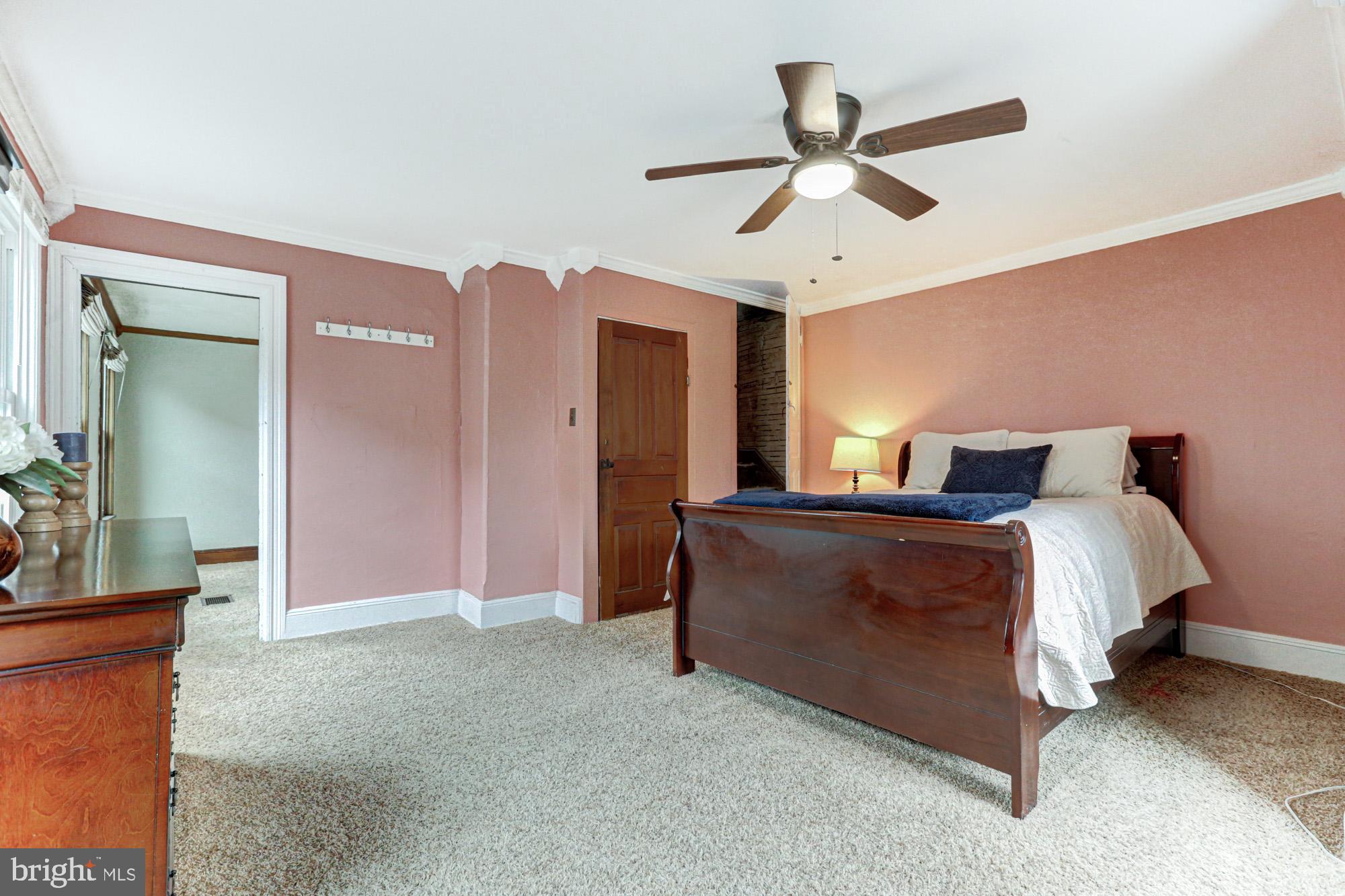 421 Main Street Clayton, DE 19938 - Photo 45 of 77 a bedroom with a bed and ceiling fan