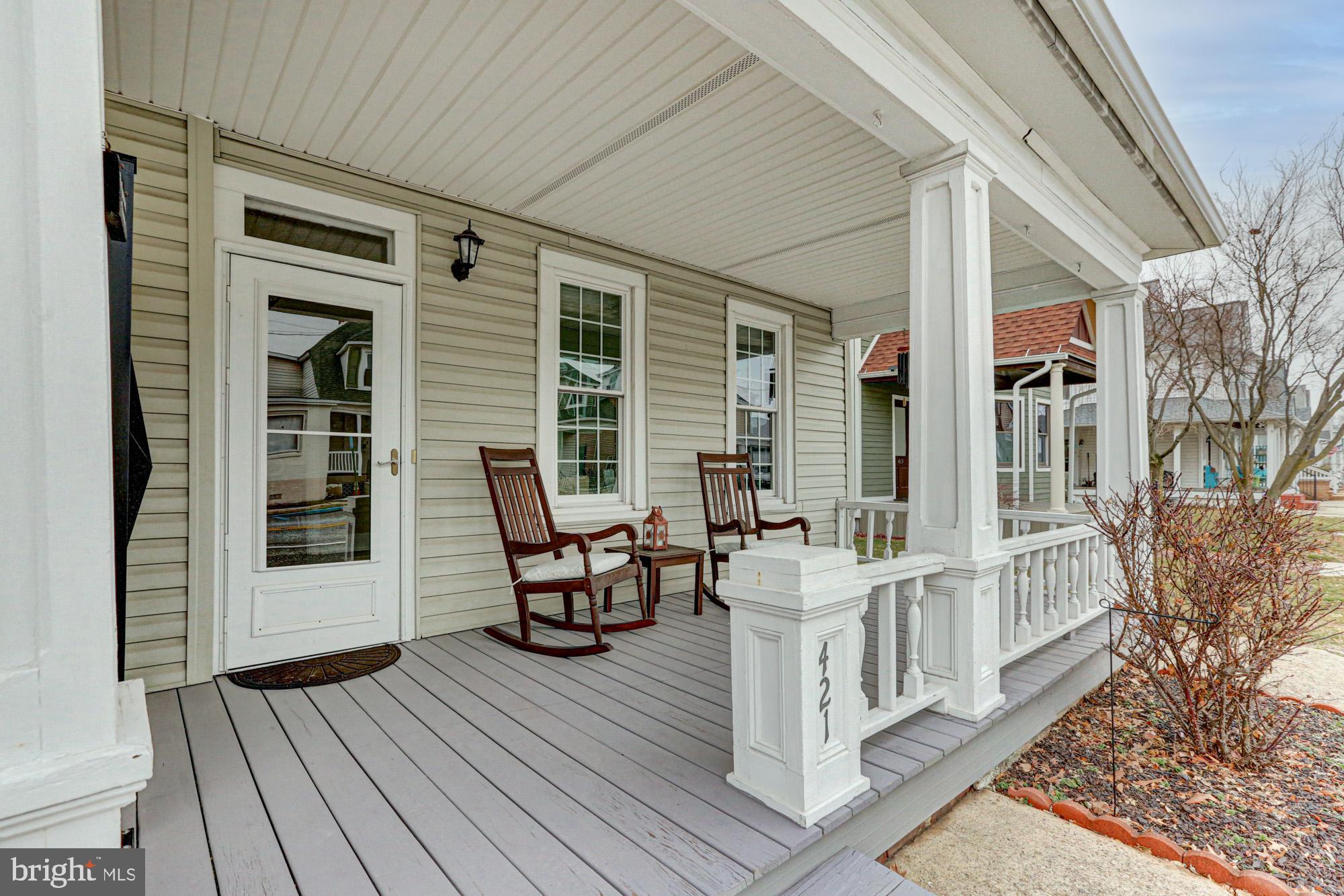 421 Main Street Clayton, DE 19938 - Photo 6 of 77 a view of a patio with table and chairs and wooden floor