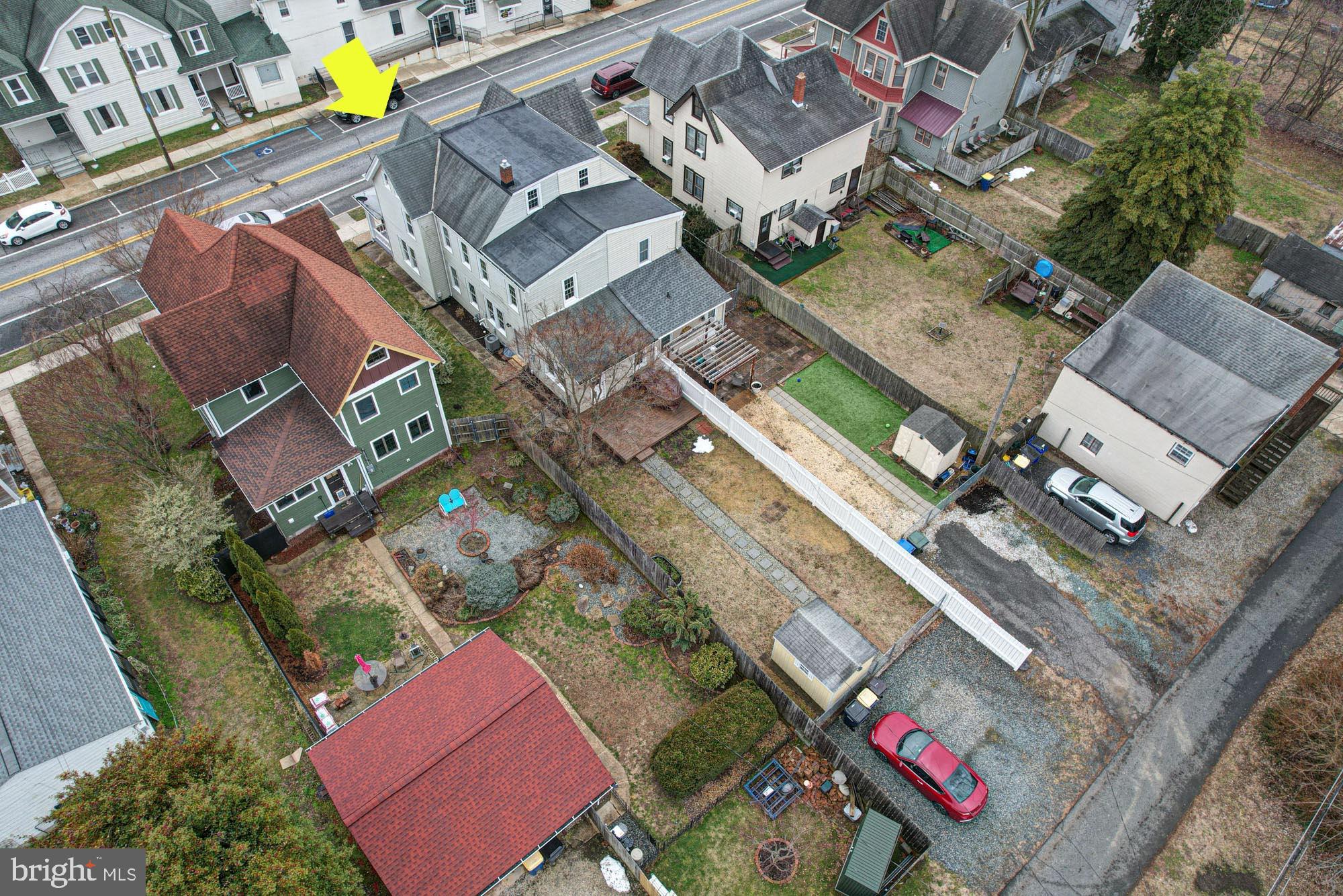 421 Main Street Clayton, DE 19938 - Photo 73 of 77 an aerial view of a city with parking