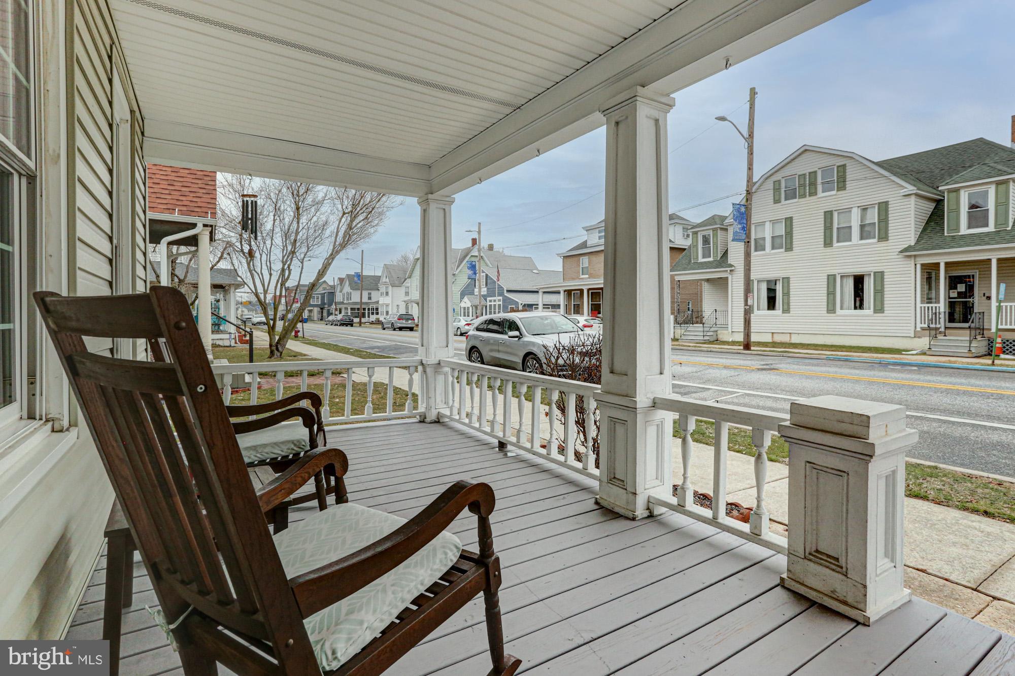 421 Main Street Clayton, DE 19938 - Photo 8 of 77 a view of a balcony with chairs