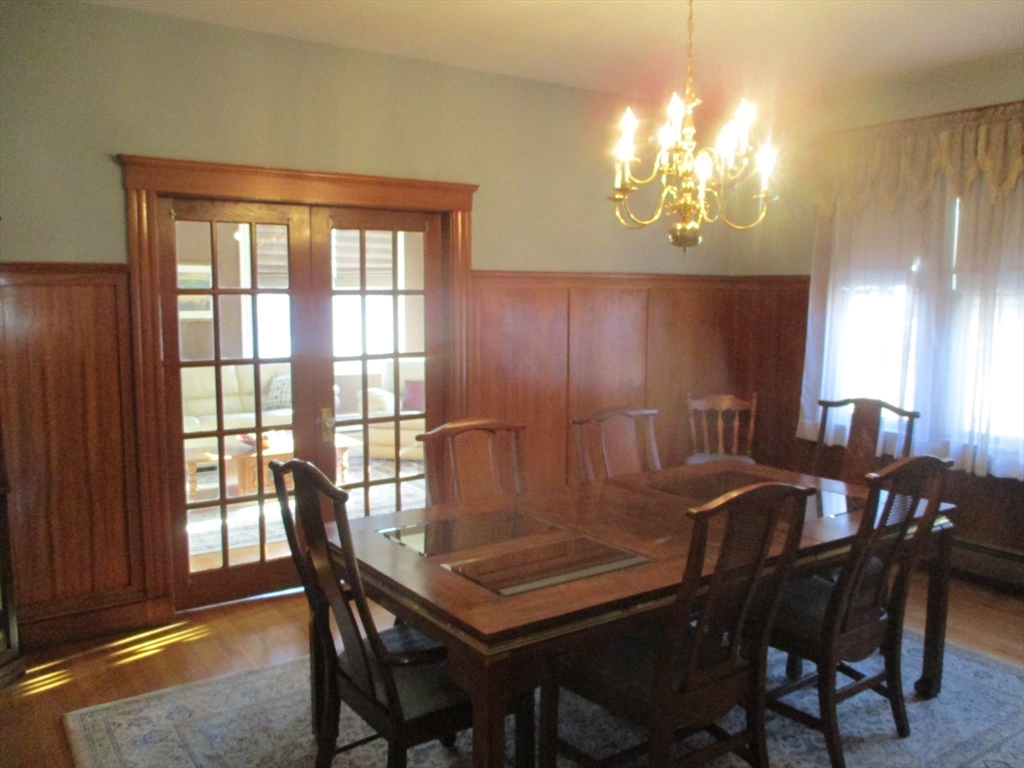 84 Tudor Street, Unit 4 Chelsea, MA 02150 - Photo 14 of 16 a view of a dining room with furniture and chandelier
