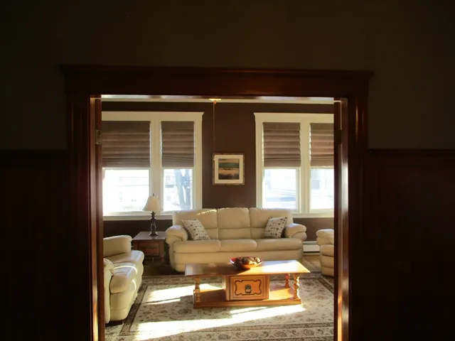 a living room with furniture and a window