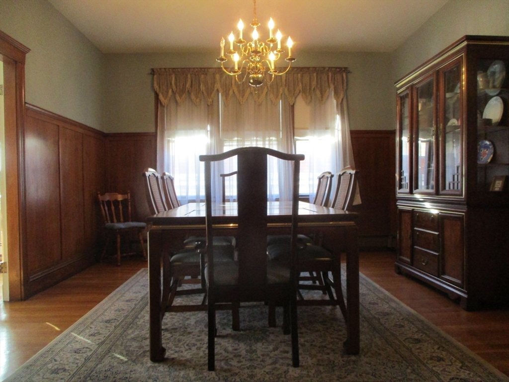 84 Tudor Street, Unit 4 Chelsea, MA 02150 - Photo 6 of 16 a view of a dining room with furniture and chandelier