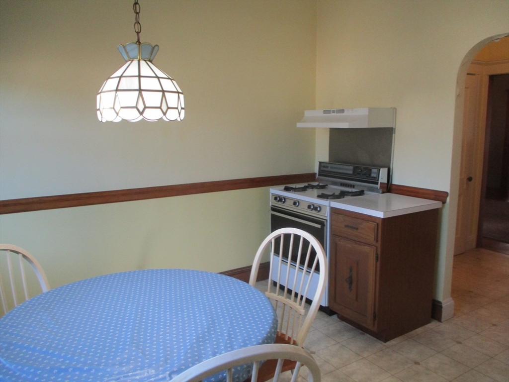 84 Tudor Street, Unit 4 Chelsea, MA 02150 - Photo 9 of 16 a bedroom with a bed and a window