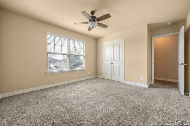 an empty room that has a window in it