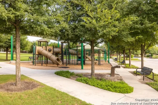 a view of a swimming pool with outdoor seating