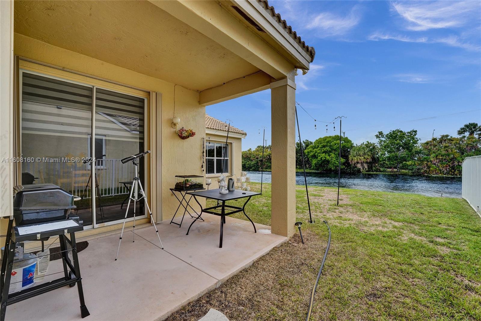 931 Falling Water Road Weston, FL 33326 - Photo 14 of 20 a house view with a seating space