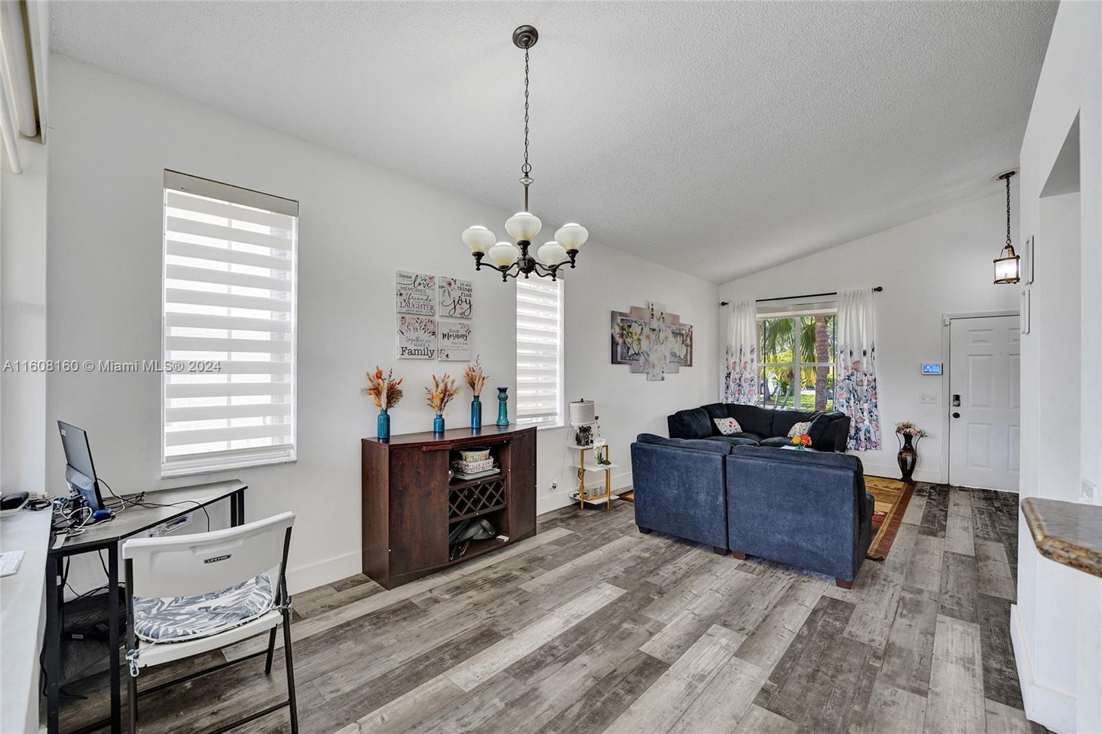 931 Falling Water Road Weston, FL 33326 - Photo 4 of 20 a living room with furniture and window