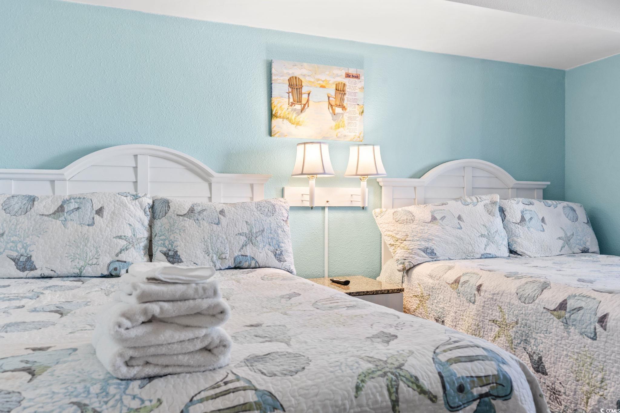 7100 North Ocean Boulevard, Unit 616 Myrtle Beach, SC 29572 - Photo 10 of 23 Bedroom featuring a textured wall