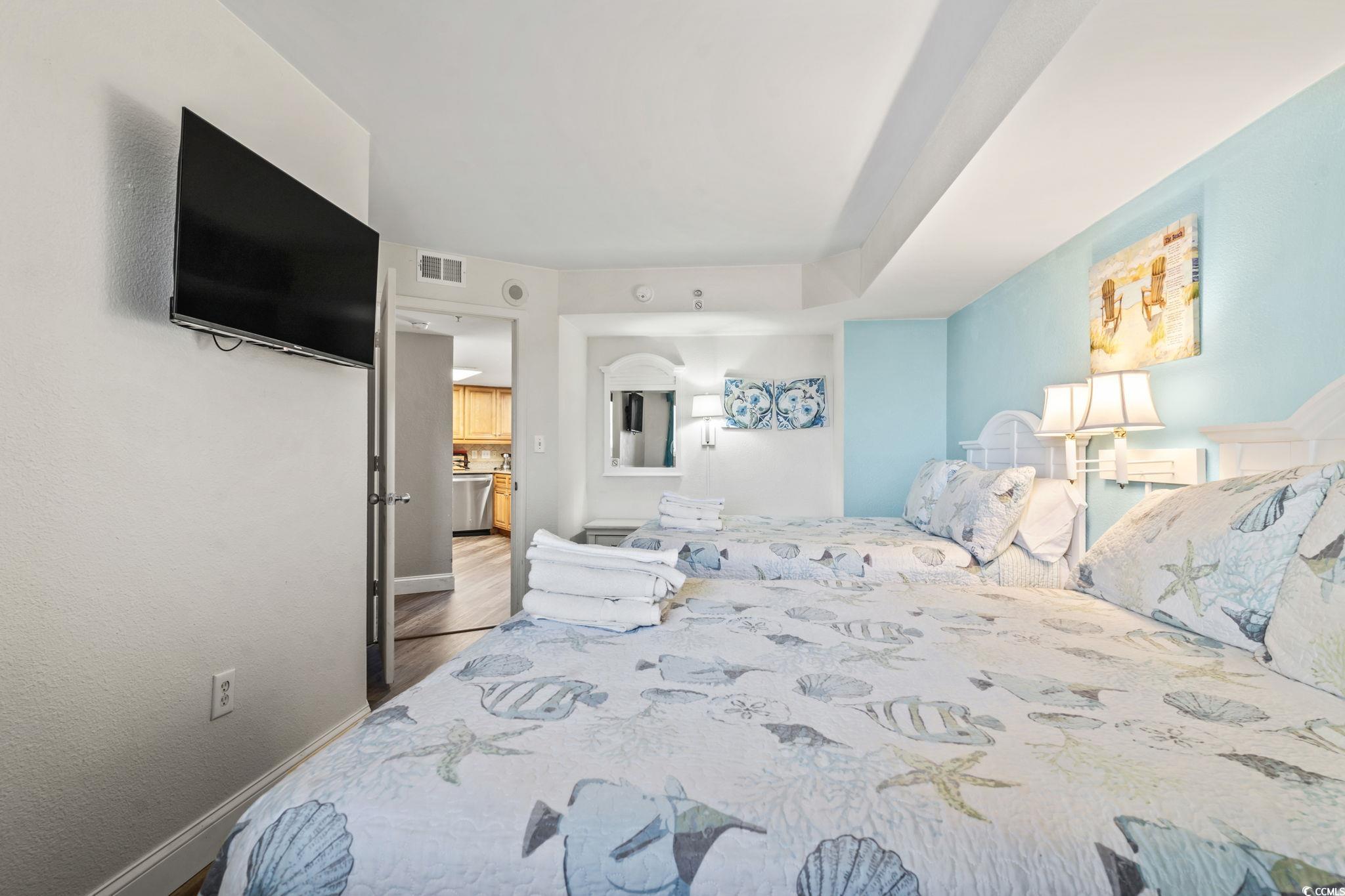 7100 North Ocean Boulevard, Unit 616 Myrtle Beach, SC 29572 - Photo 11 of 23 Bedroom with baseboards and wood finished floors