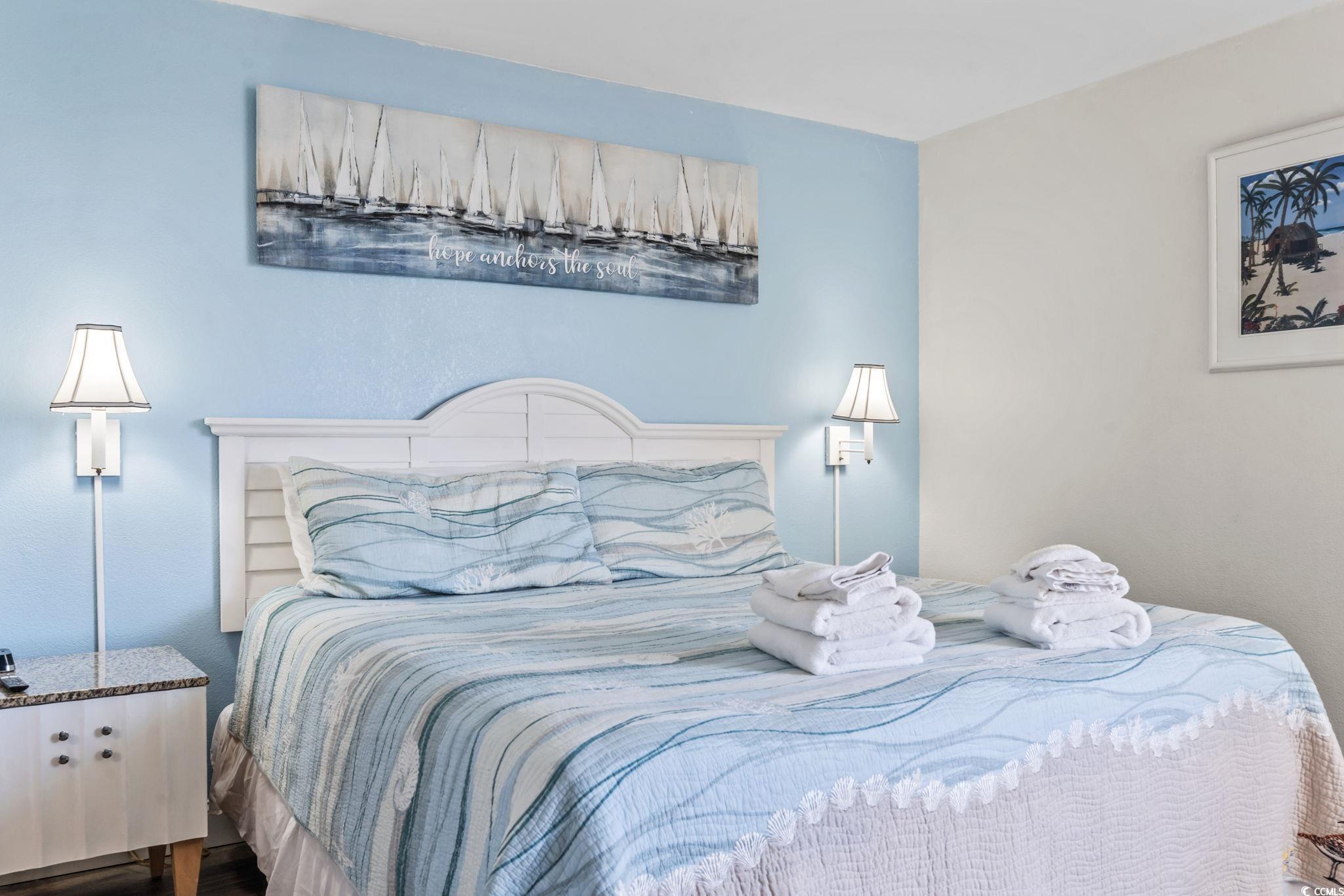 7100 North Ocean Boulevard, Unit 616 Myrtle Beach, SC 29572 - Photo 17 of 23 Bedroom with wood finished floors