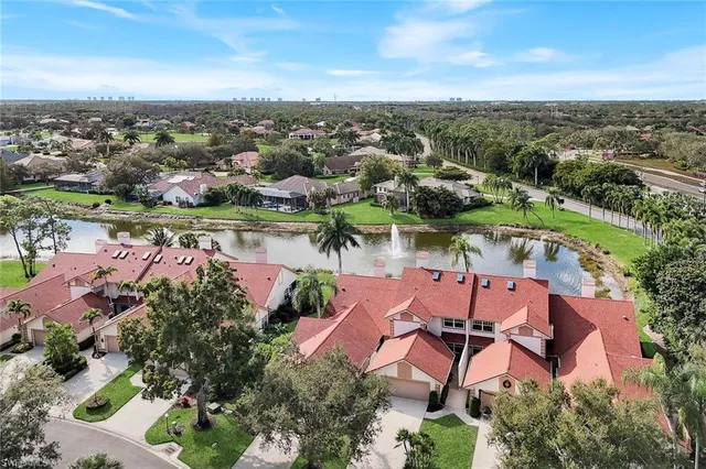 an aerial view of a city with lake view