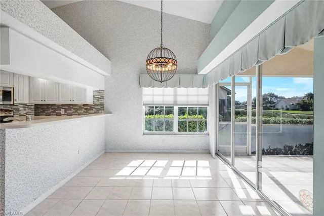 a view of an entryway with chandelier