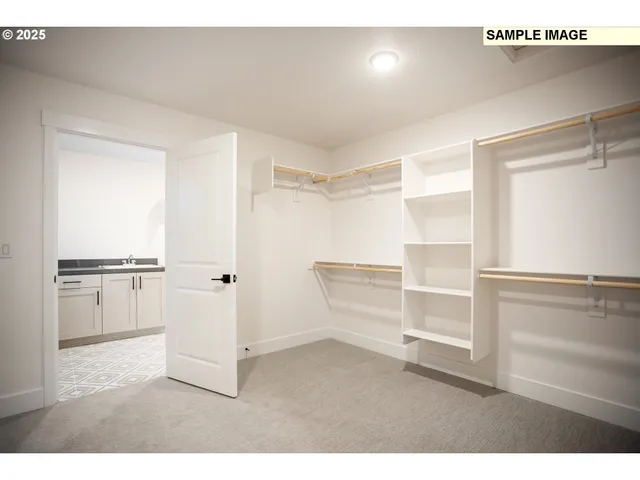 a view of walk in closet with empty racks