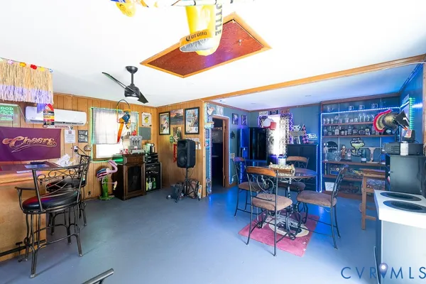 a living room with lots of furniture and lots of furniture