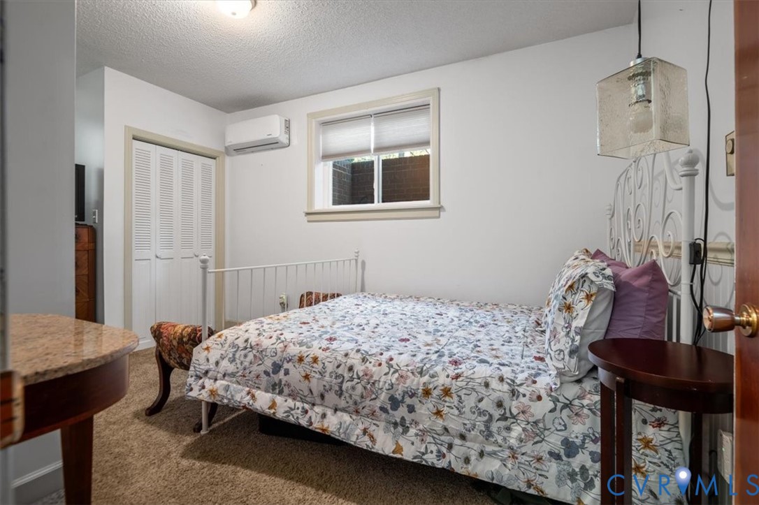 18522 Goode Lane Dinwiddie, VA 23841 - Photo 52 of 99 a bedroom with a bed and a table in it