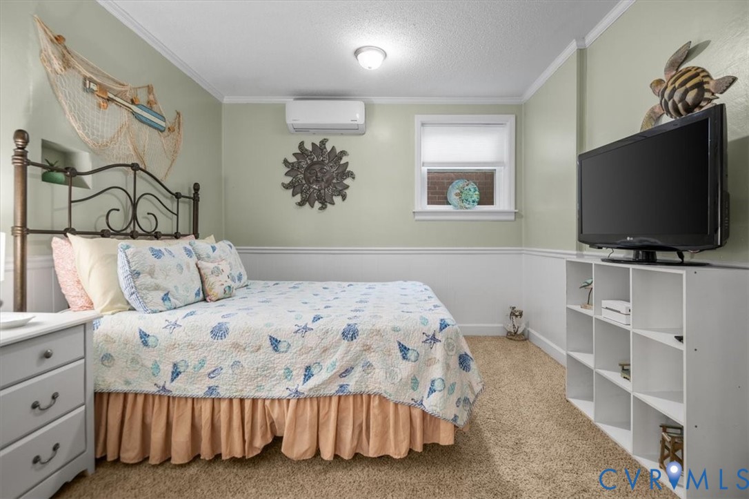 18522 Goode Lane Dinwiddie, VA 23841 - Photo 54 of 99 a bedroom with a bed and a flat screen tv