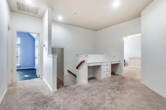 a kitchen with a sink and a refrigerator