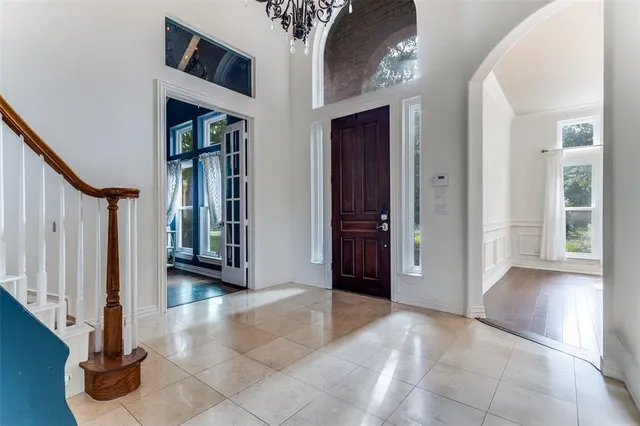 a view of work space with wooden floor and windows