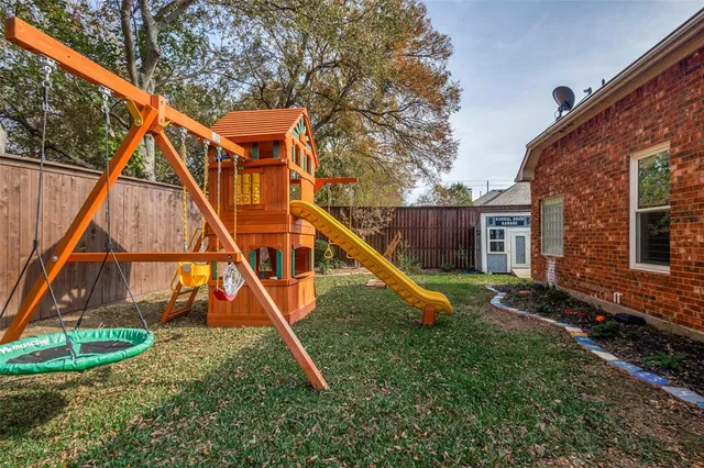 a view of a house with a yard and sitting area