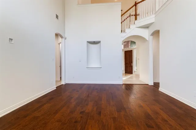 a bedroom with a bed and a tv