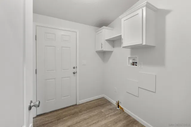 a view of cabinets and wooden floor