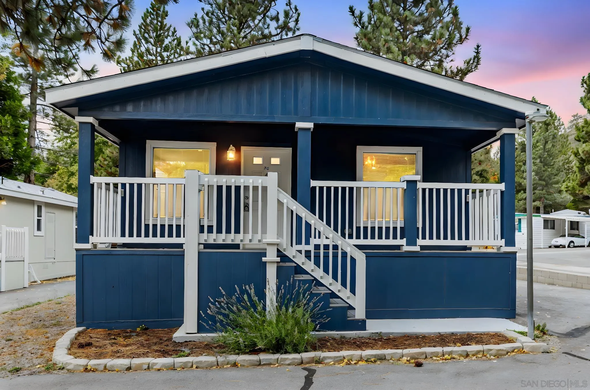 22899 Byron Road, Unit SPC 78 Crestline, CA 92325 - Photo 18 of 28 a view of a house with wooden deck and furniture