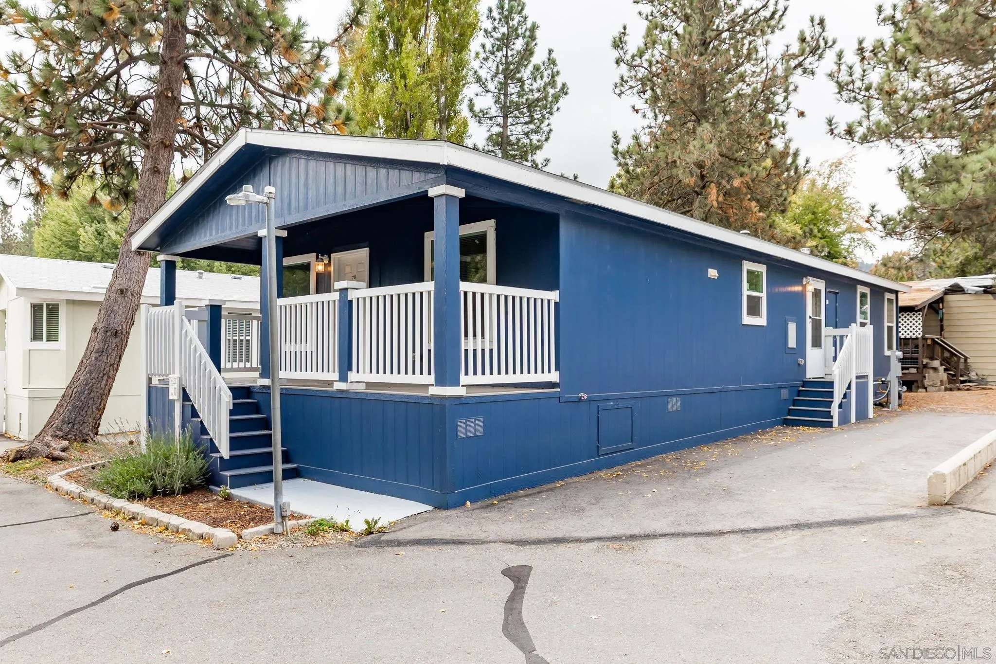 22899 Byron Road, Unit SPC 78 Crestline, CA 92325 - Photo 20 of 28 a front view of a house with garden