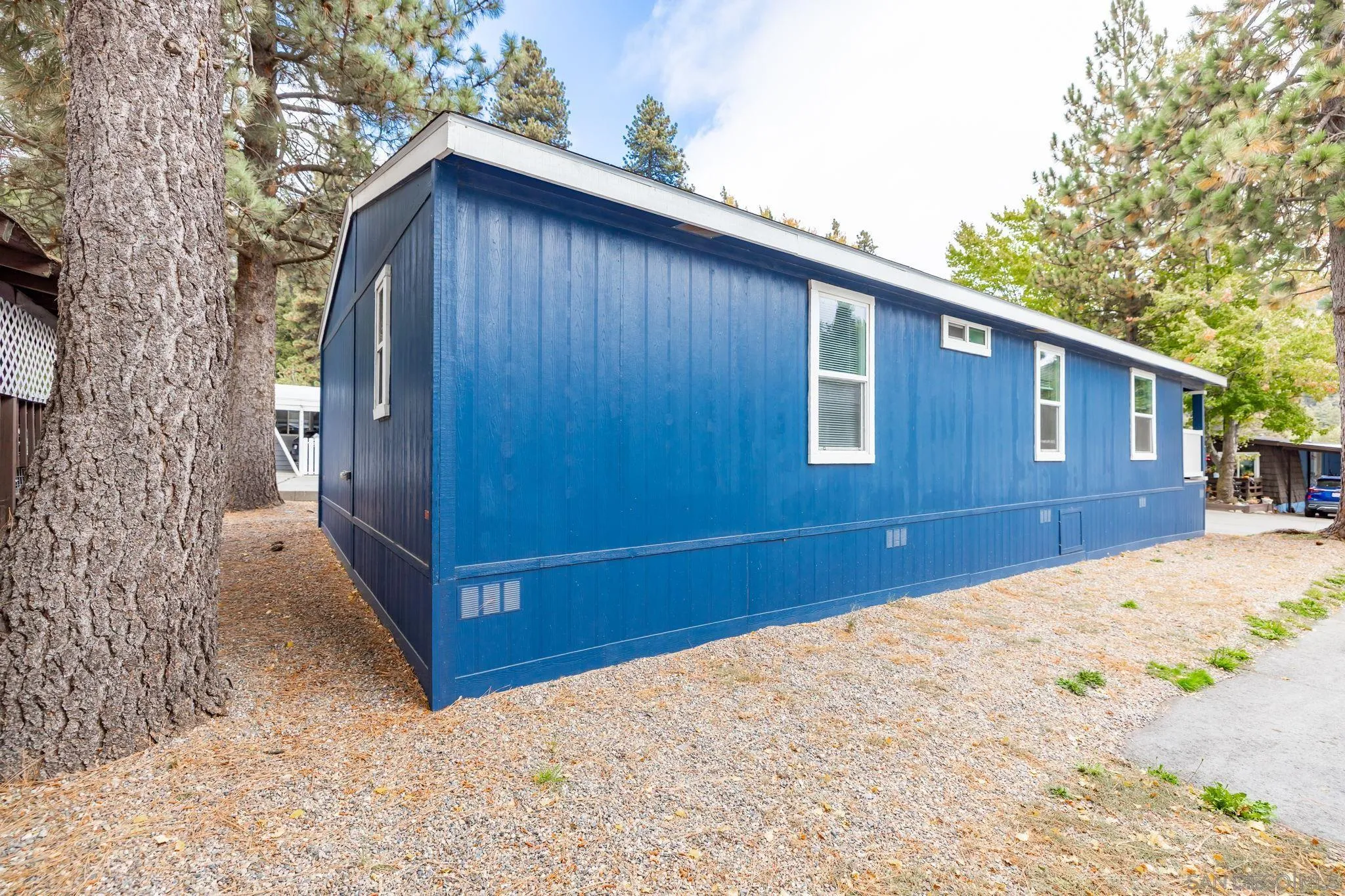 22899 Byron Road, Unit SPC 78 Crestline, CA 92325 - Photo 23 of 28 a view of backyard with a large tree