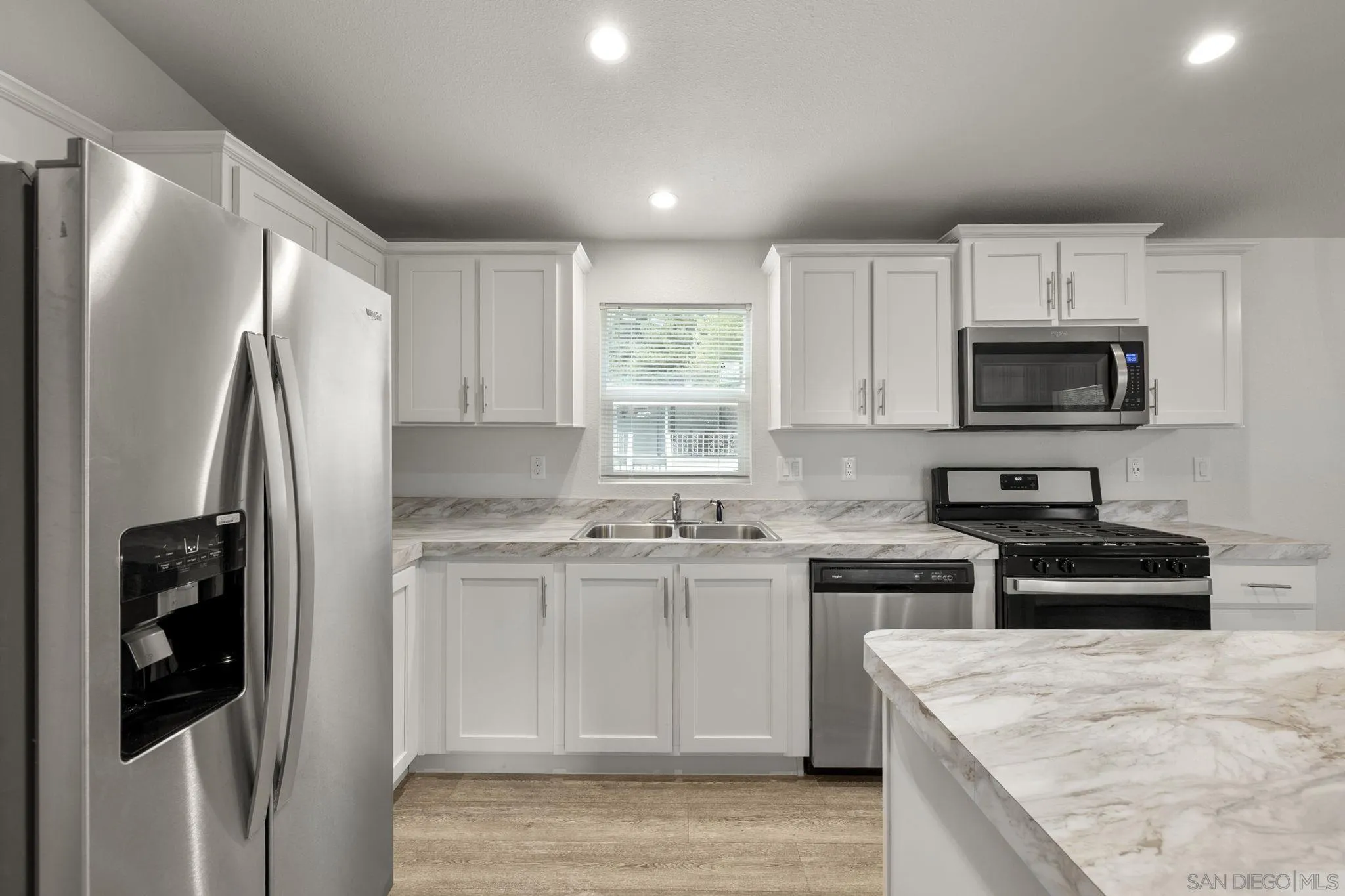 22899 Byron Road, Unit SPC 78 Crestline, CA 92325 - Photo 4 of 28 a kitchen with a refrigerator and a stove top oven