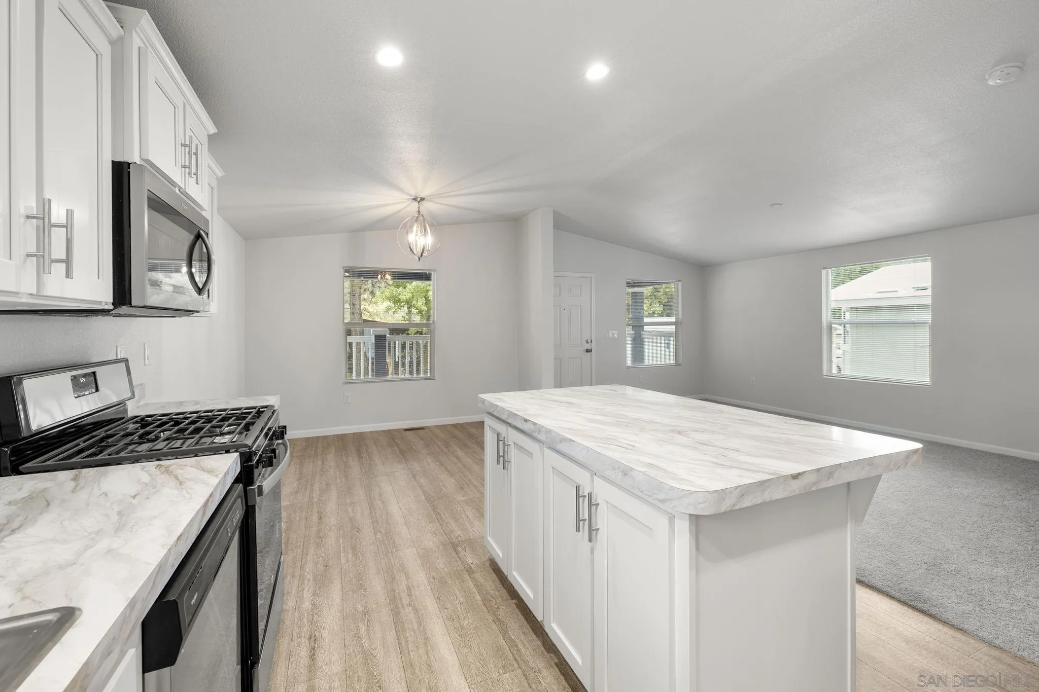 22899 Byron Road, Unit SPC 78 Crestline, CA 92325 - Photo 5 of 28 a kitchen that has a sink a stove and a table in it