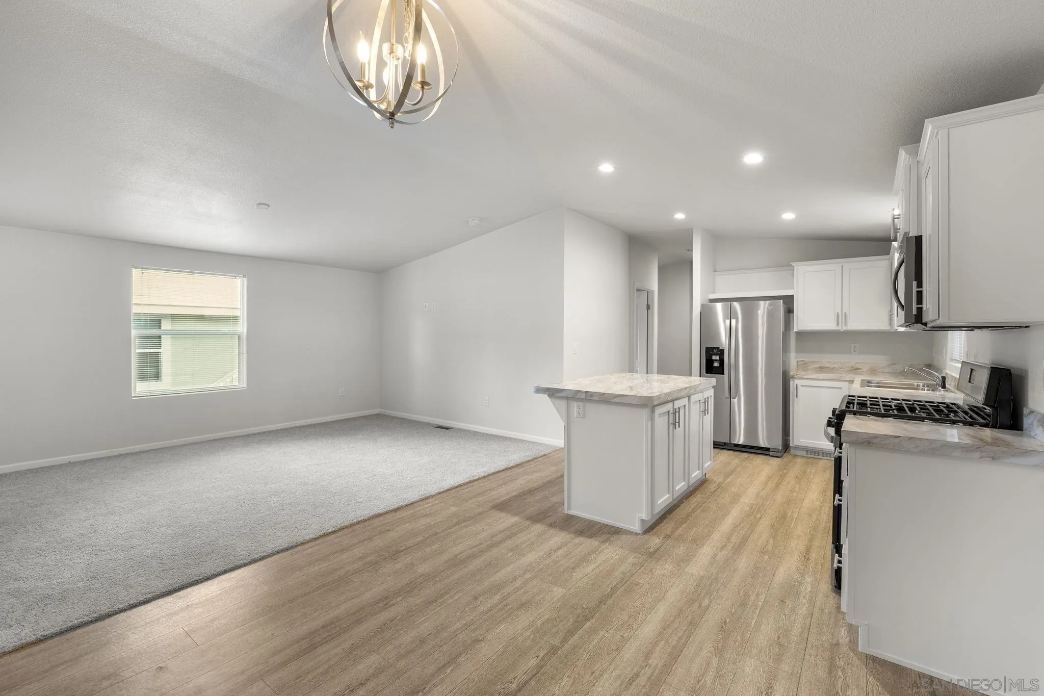22899 Byron Road, Unit SPC 78 Crestline, CA 92325 - Photo 6 of 28 a view of kitchen with refrigerator stove and wooden floor