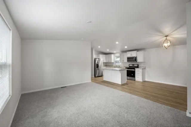 a view of kitchen with wooden floor