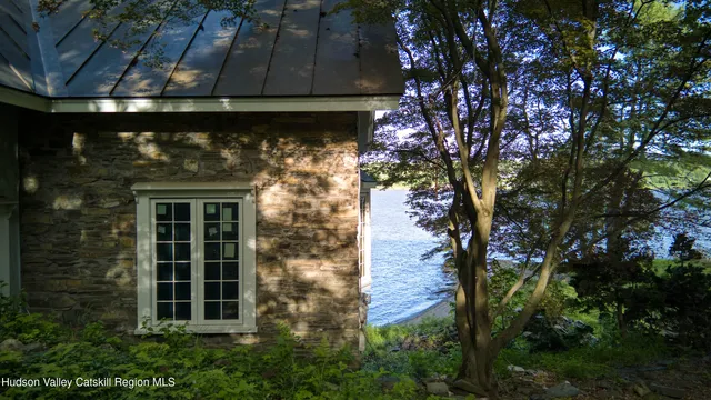 a view of house with yard