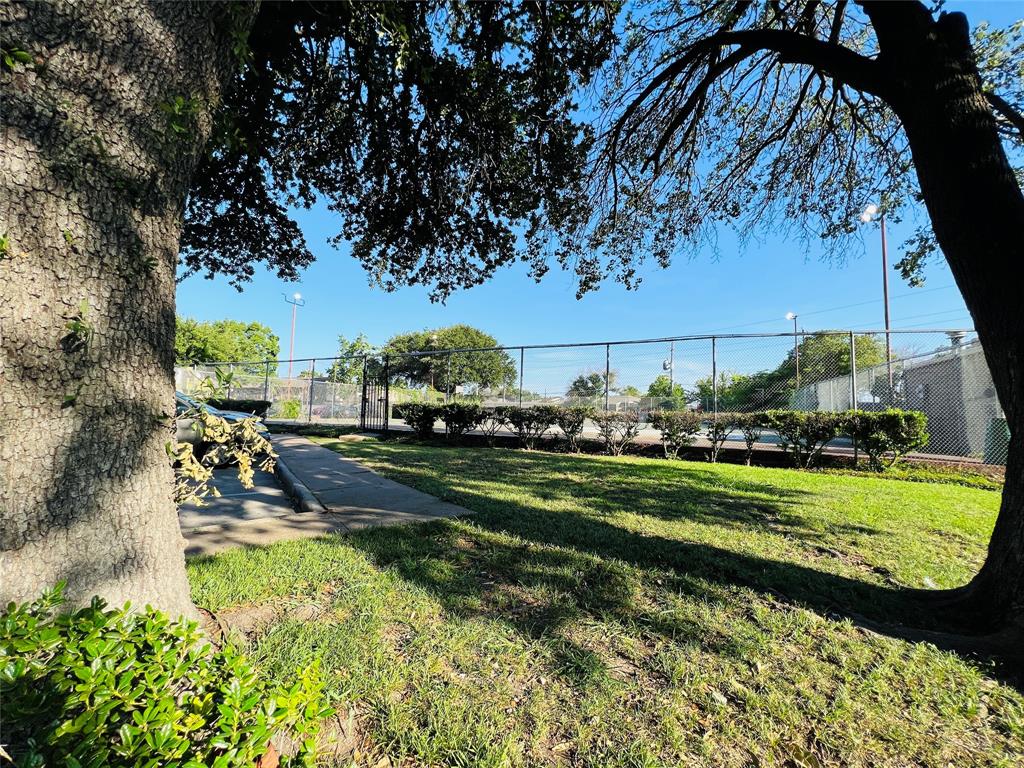 9823 Walnut Street, Unit 307 Dallas, TX 75243 - Photo 7 of 8 a view of a park with large trees