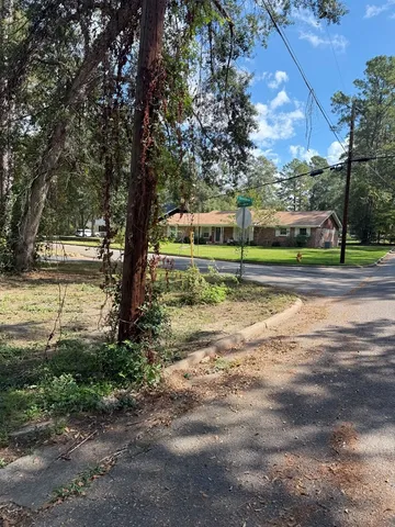 a view of a park and trees