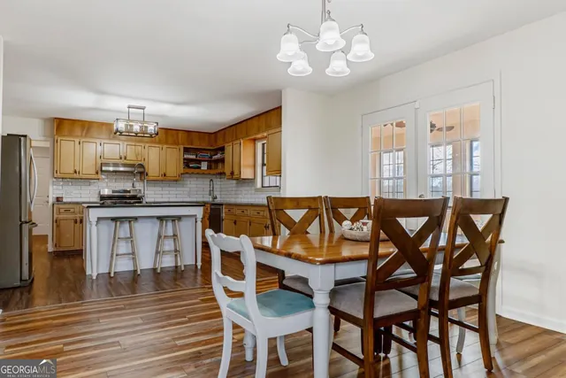 a kitchen with cabinets a sink and appliances