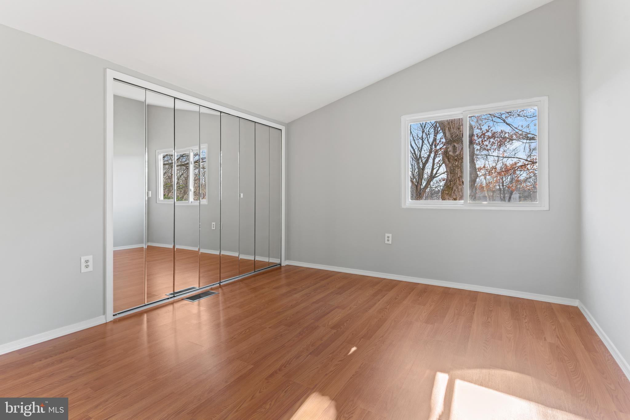 6145 Sinbad Place Columbia, MD 21045 - Photo 15 of 23 an empty room with wooden floor and window