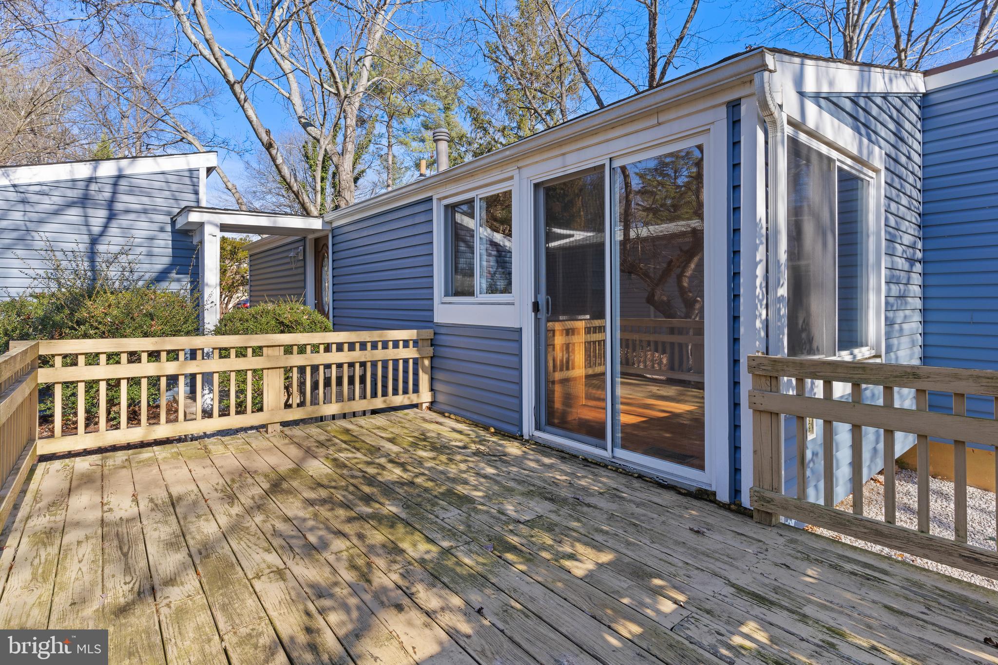 6145 Sinbad Place Columbia, MD 21045 - Photo 19 of 23 a view of a house with a small yard and wooden floor and fence