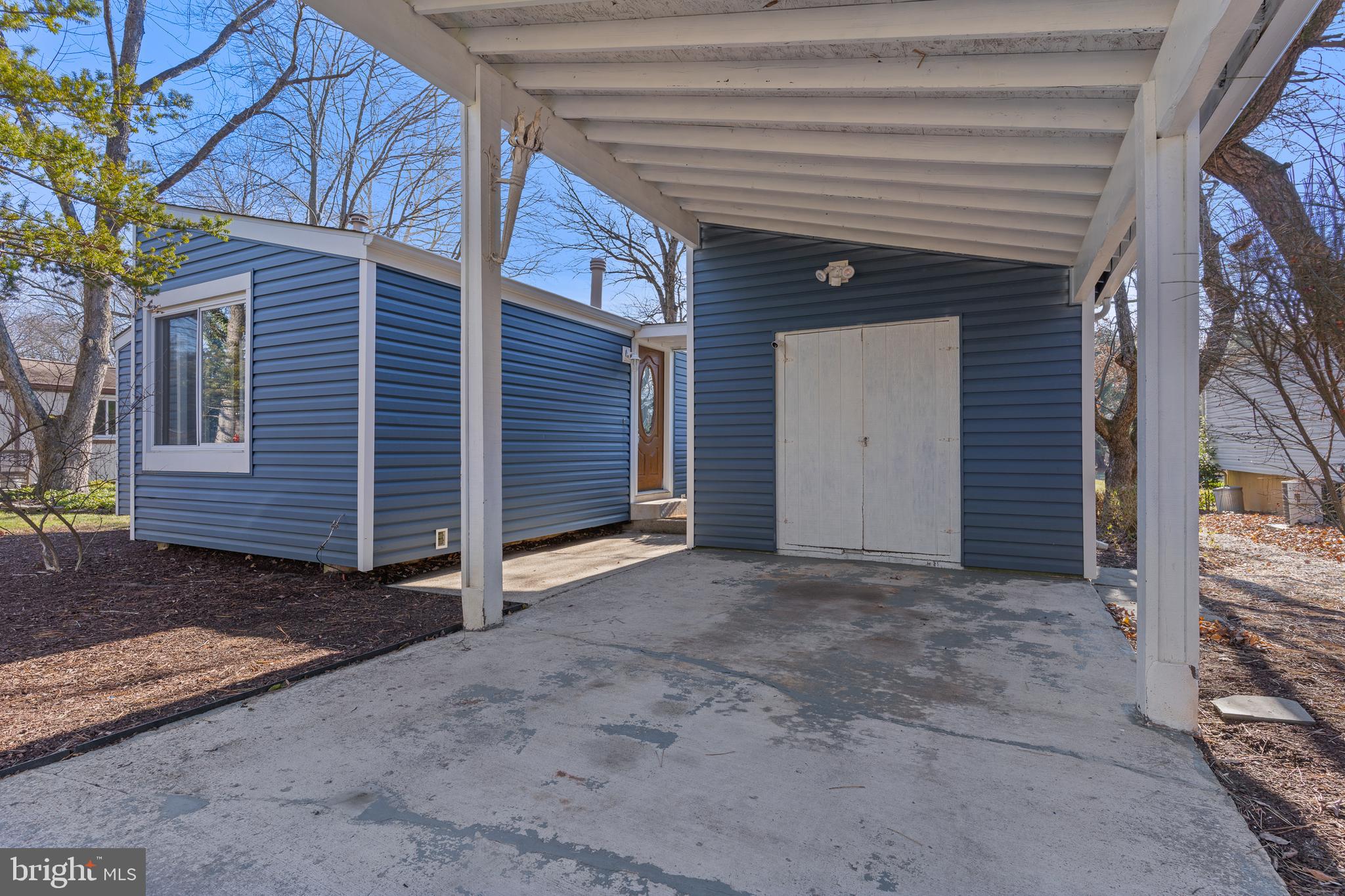 6145 Sinbad Place Columbia, MD 21045 - Photo 2 of 23 a view of a house with a backyard and garage