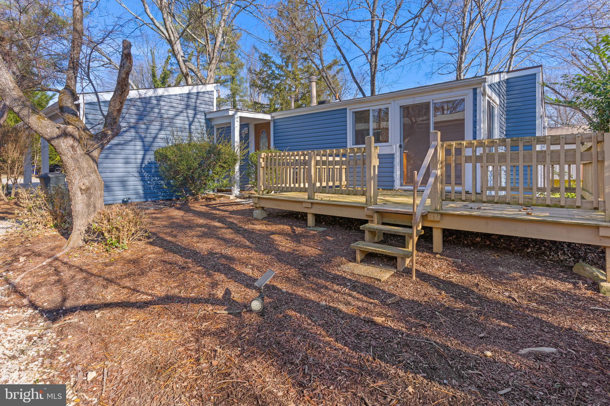 6145 Sinbad Place Columbia, MD 21045 - Photo 21 of 23 a backyard of a house with barbeque oven and table and chairs
