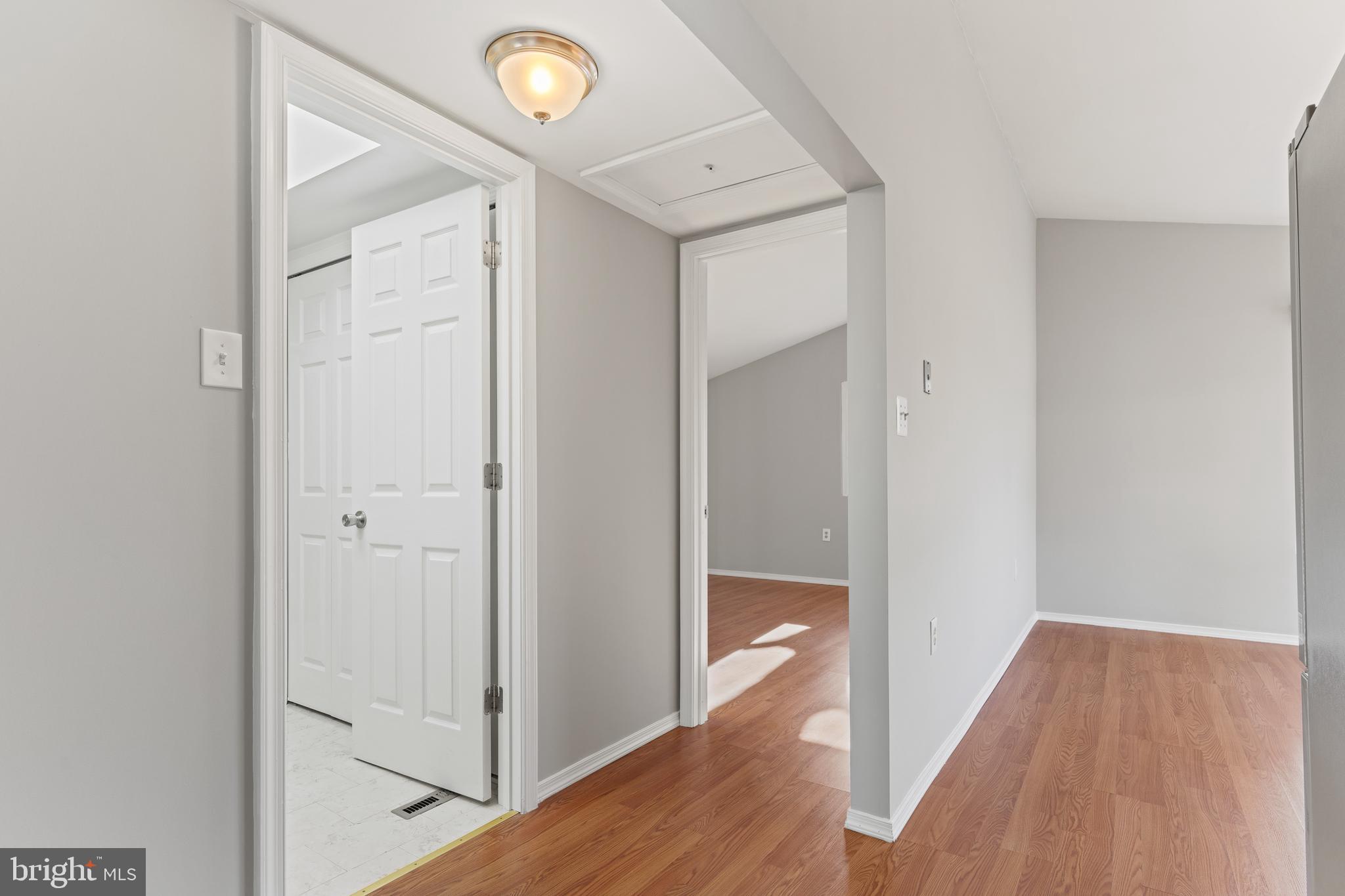 6145 Sinbad Place Columbia, MD 21045 - Photo 7 of 23 a view of a hallway with wooden floor