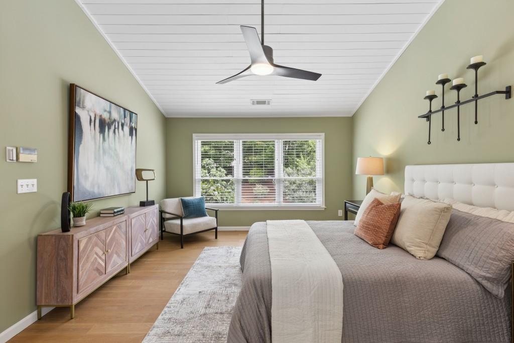 2120 Traywick Chase Alpharetta, GA 30004 - Photo 25 of 54 a spacious bedroom with a large bed and a chandelier